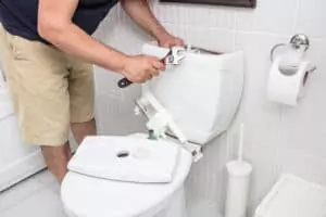 repairing toilet